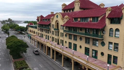 Ornate red-tile-roofed historic building lines empty downtown Stockton street Stock Footage 339994606