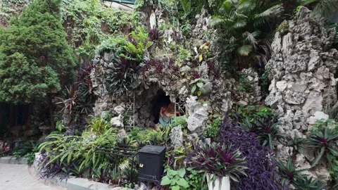 Ornate religious grotto built into a stone rockery. Combining natural elements Stock Footage 337467287