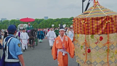 Ornate Silk Float at Sanno Matsuri – Orange Robes and Ceremonial Parade Stock Footage 339820766