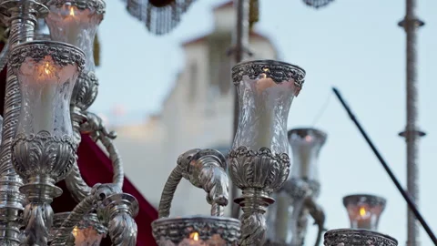 Ornate silver candelabra lighting Spanish Holy Week procession Stock Footage 333880324
