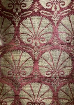Ornate textile pattern with red and beige motif, suitable for vintage or an.. Stock Photos