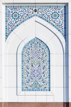Ornate tilework arch on the facade of Minor mosque in Tashkent with intrica.. Stock Photos