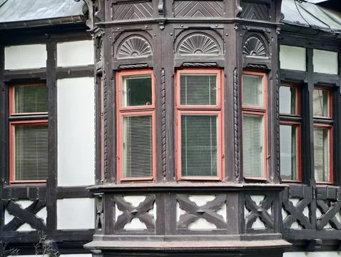 Ornate timber framed bay window with decorative plaster infill Stock Photos