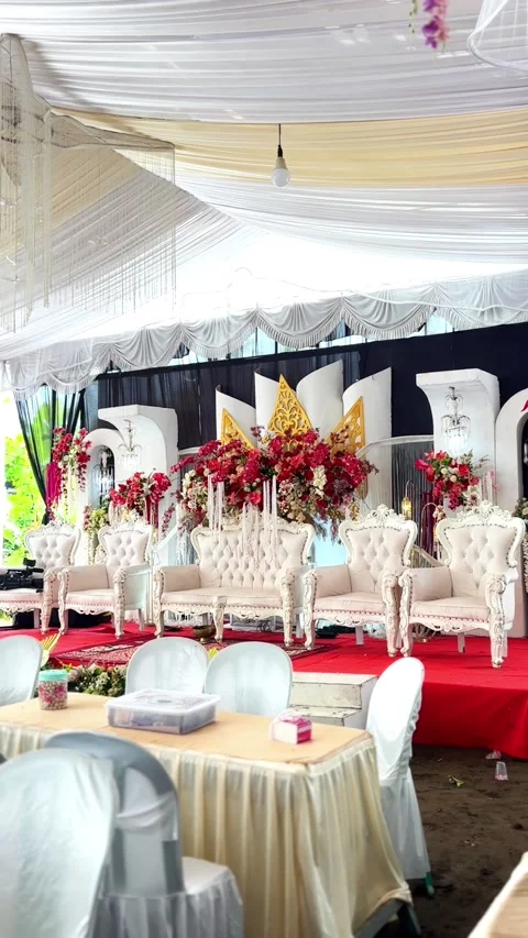 Ornate wedding stage setup with white seating motion footage Video stock 330657967