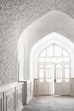 Ornate white plaster interior of Muhammad Amin Khan Madrasah in Khiva with .. Stock Photos