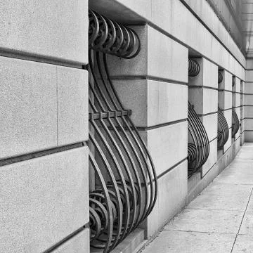 Ornate window bars on building Stock Photos