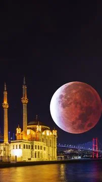 Ortakoy Mosque and lunar eclipse. Islamic or ramadan vertical photo Stock Photos