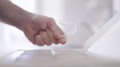 Orthodontist Checking Vacuum Form Retainer Video stock 76081806