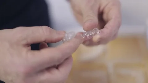 Orthodontist Checking Vacuum Form Retainer Stock Footage 76081816