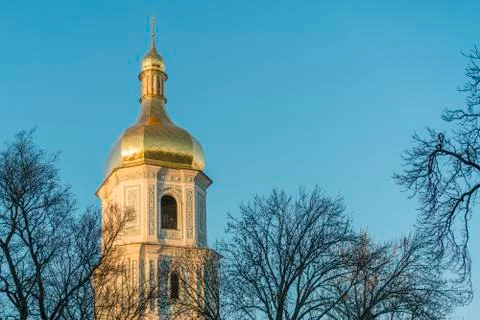 Orthodox belfry in the rays of sunset Stock Photos
