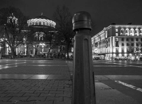 Orthodox cathedral next to a representative building in downtown at night Stock Photos