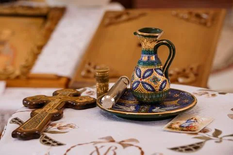Orthodox Christian ritual objects including an ornate ceramic pitcher and w.. Stock Photos