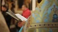 Orthodox Church clergyman reading psalm book, conducting festive service, prayer HD Footage