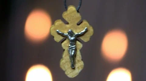 Orthodox cross on a background of candle lights Stock Footage 57257900