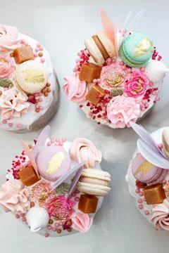 Orthodox easter bread called Kulich, richly decorated with sweets, macaroons, Stock Photos