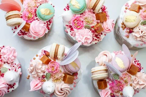 Orthodox easter bread called Kulich, richly decorated with sweets, macaroons, Stock Photos