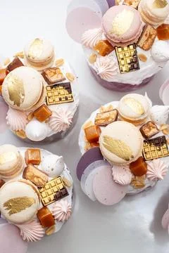 Orthodox easter bread richly decorated with sweets, macaroons, chocolate an.. Stock Photos
