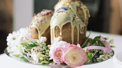 Orthodox Easter cakes in modern interior and with  flowers, dolly fly around Video stock 62290838