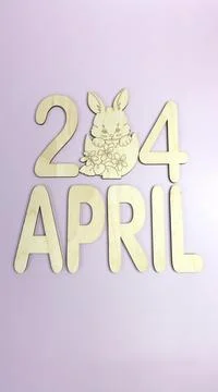 Orthodox Easter date - April 24, decorative wooden elements. Vertical. Stock Photos
