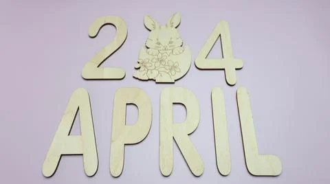 Orthodox Easter date - April 24, decorative wooden elements. Stock Photos