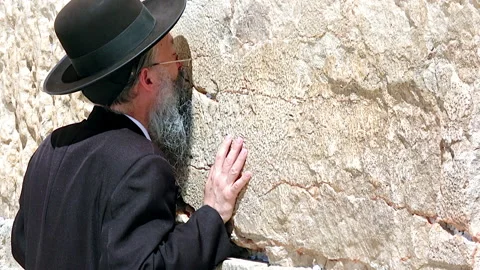 Orthodox Jew praying at the Wailing Wall in Jerusalem Israel Stock Footage