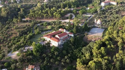Orthodox monastery with bell tower surrounded by peaceful olive groves Stock Footage 344095324