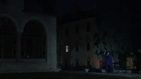 Orthodox monk ringing a semantron at night in Mount Athos Stock Footage 330196561