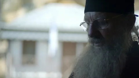 Orthodox monk using a modern smartphone in Mount Athos Stock Footage 330195943