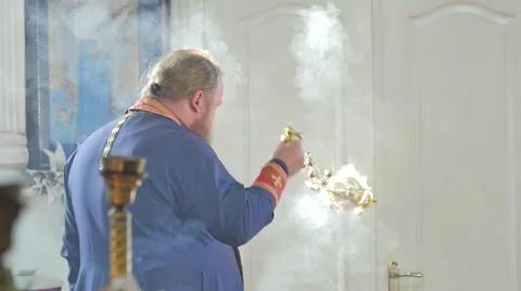 Orthodox Priest is Using an Incensory Trinity Day Service Church in Ukraine 動画素材 64106387