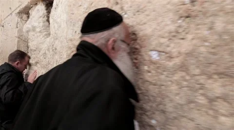 Orthodox religious Jew pray Wailing Western Wall of old city Jerusalem Steadicam Stock Footage
