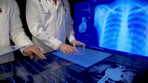 Orthopedic Doctors looking x-rays Stock Footage 194817854