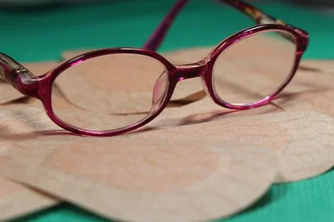 Orthoptic Eye Patch for occlusion therapy with child´s glasses Stock Photos