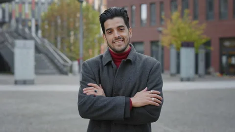 Ortrait of the Handsome Smiling Multi Ethnic Businessman Standing, Crossing Stock Footage 237606103