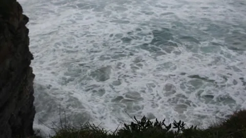 Os Castros beach at sunset with big waves, Ribadeo, Spain Stock Footage 303671076
