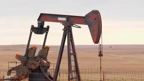 OSAGE CO., OK - 2 MAR 2020: Oil Well Pump Jack pumping crude oil . Stock Footage 142958022