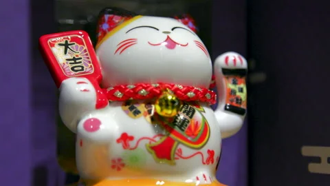 Osaka, Japan - 2026/04/27: Maneki Neko Lucky Cat Waving, Symbol of Fortune Stock Footage 336830406