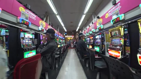 OSAKA, JAPAN : View inside Pachinko parlor. Mixture of slot machine and pinball. Видео 283687640