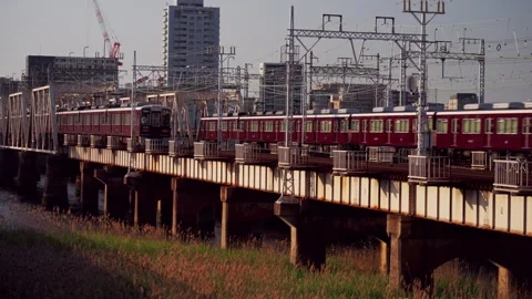 Osaka train goes over a bridge 스톡 동영상 283177372