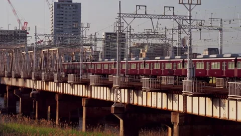 Osaka train goes over a bridge 스톡 동영상 283177422