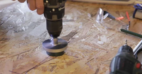 OSB hole cutting cordless drill Stock Footage 329427312