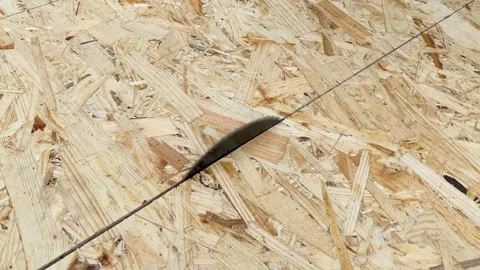 OSB Oriented strand board plate being cut by circular saw disk Vídeo Stock 243939339