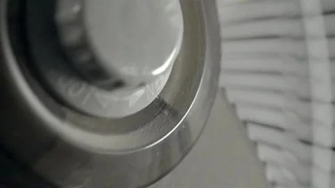 Oscillating Electric Fan Turning in Close-Up Against Bright Background 스톡 동영상 344964264