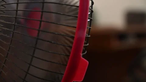Oscillating Fan with Blurred Person Working at Home Stock Footage 346487106