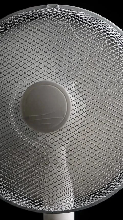Oscillating floor fan on black background loop Stock Footage 342348327