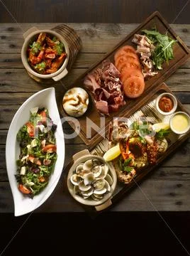 Osia Steak Seafood Grill with clams, shrimp, octopus, squid, mussel, salad, b Stock Photos