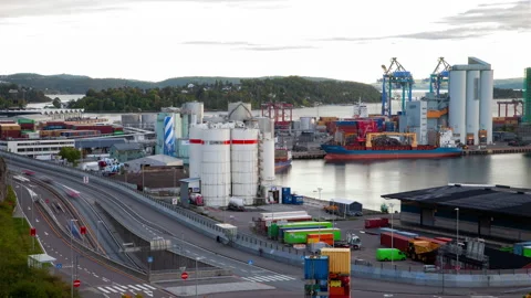 Oslo cargo containers port timelapse with cranes and highway traffic Stock Footage 230112807