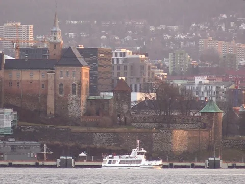 Oslo, Norway - Boat Passes in front of Akershus Fortress Stock Footage