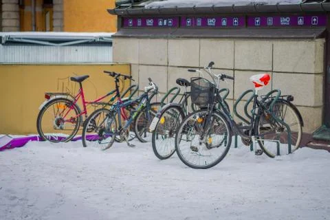 OSLO, NORWAY - MARCH, 26, 2018: Outdoor view of many bycicles parked in the snow Stock Photos