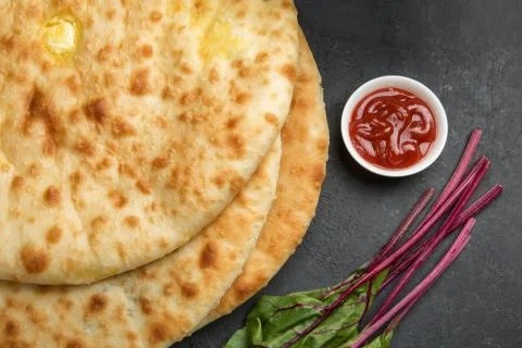 Ossetian pies on the dark table Stock Photos