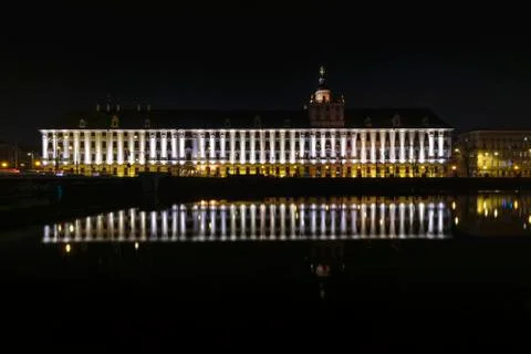Ossolineum Library. With reflection in Odra River at night. Stock Photos